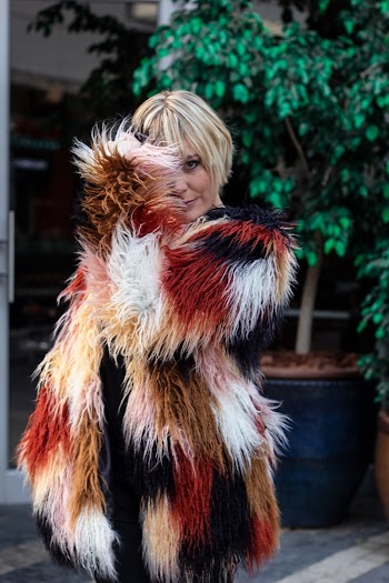 Woman Wearing Red, Black And Brown Fur Coat