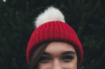 woman wearing red bobble hat