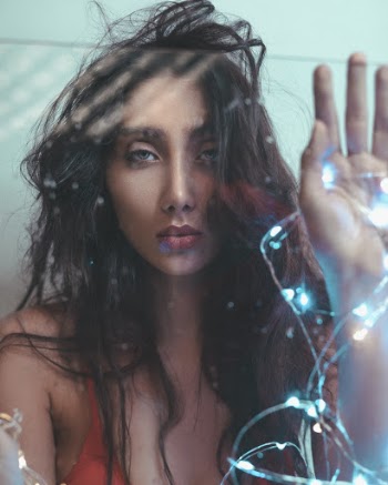 Woman Wearing Red Bra Holding Blue String Lights