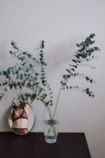 Woman Wearing Red Bra in Room