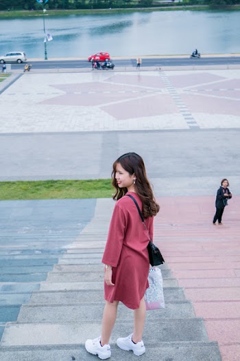 Woman Wearing Red Clothes and Pair of White Running Shoes