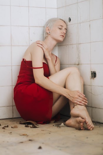 Woman Wearing Red Dress Sitting on Floor