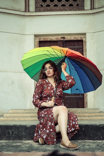 Woman Wearing Red Floral Long Sleeve Dress Holding Umbrella