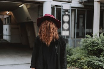 Woman Wearing Red Hat While Standing Outside