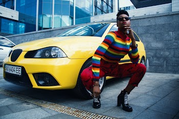 Woman Wearing Red Leggings Beside Yellow Car