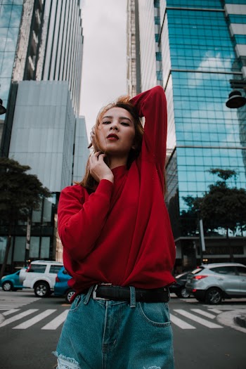 Woman Wearing Red Long-sleeved Shirt and Blue Denim Short