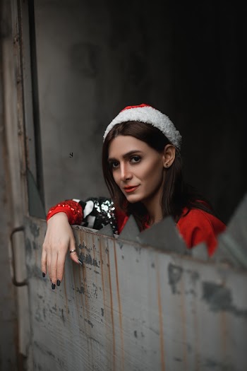 Woman Wearing Red Santa Hat