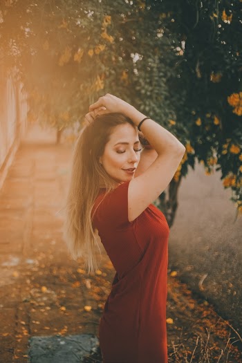 Woman Wearing Red Short-sleeved Dress Near Tree