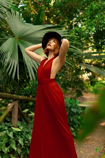 Woman Wearing Red Sleeveless Dress Posing