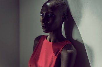 woman wearing red sleeveless top