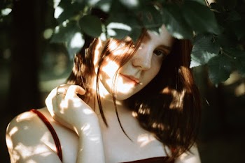 Woman Wearing Red String Strap Top Photo Under Green Tree
