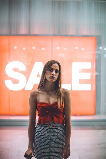 Woman Wearing Red Sweetheart Neckline Top and Gray Mini Skirt