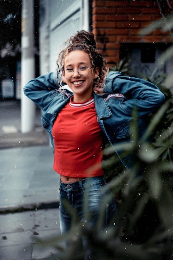 Woman Wearing Red T-Shirt and Blue Denim Jacket