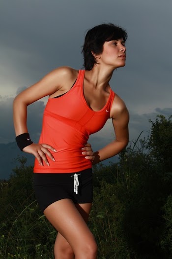Woman Wearing Red Tank Top and Black Drawstring Shorts