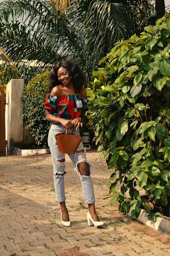Woman Wearing Ripped Jeans