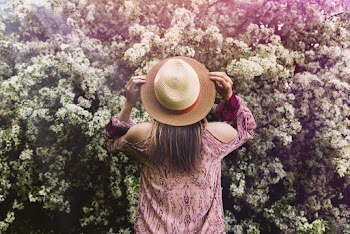 Woman Wearing Round Brown Hat