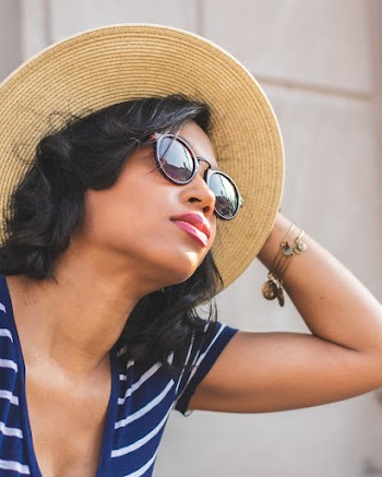 Woman Wearing Round Brown Hat