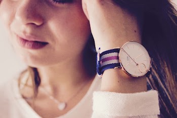 Woman Wearing Round Gold-colored Daniel Willington Analog Watch