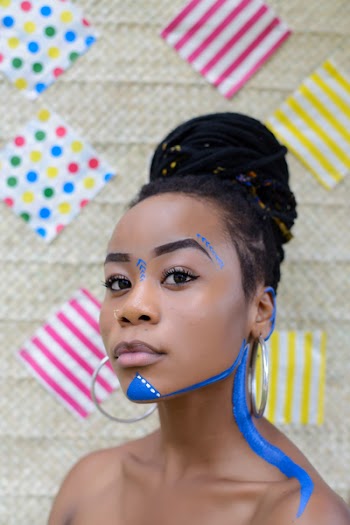 Woman Wearing Silver-colored Hoop Earrings