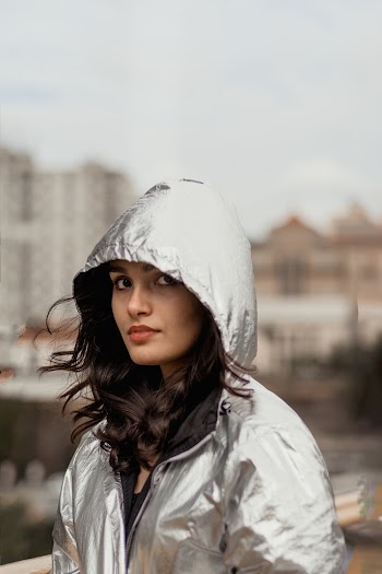 Woman Wearing Silver Hooded Jacket