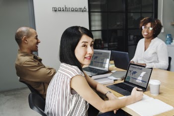 Woman Wearing Sleeveless Top Sitting On Chair