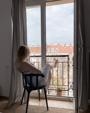 Woman Wearing Spaghetti Strap Dress Sitting On Chair 