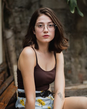 Woman Wearing Spaghetti Strap Top and Eyeglasses
