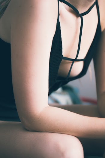 Woman Wearing Strappy Top While Sitting