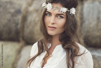 Woman wearing stylish white dress in the country side