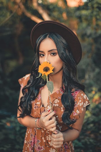 Woman Wearing Sun Hat and Floral Dress