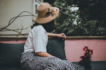 Woman Wearing Sun Hat Looking Backward