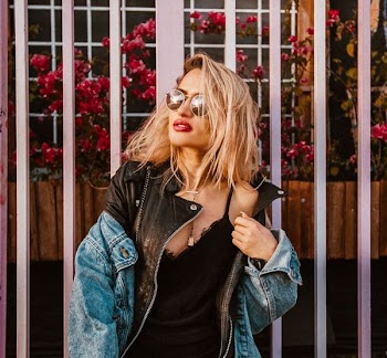 woman wearing sunglasses and black spaghetti strap shirt