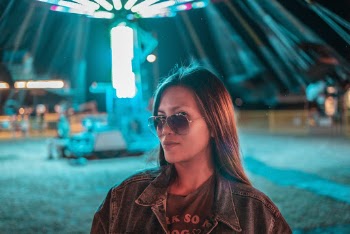 Woman Wearing Sunglasses and Denim Jacket