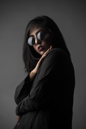 Woman Wearing Sunglasses and Long-sleeved Top