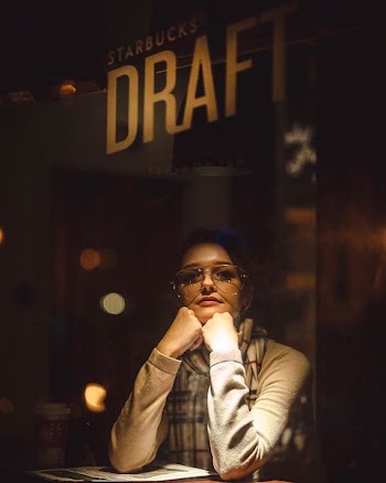 woman wearing sunglasses holding her chin