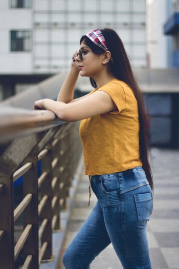 Woman Wearing Sunglasses Near High-rise Buildings