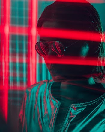 Woman Wearing Sunglasses Near Red Lights