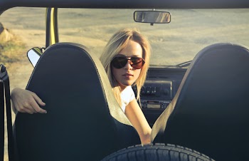 Woman Wearing Sunglasses Riding in Car