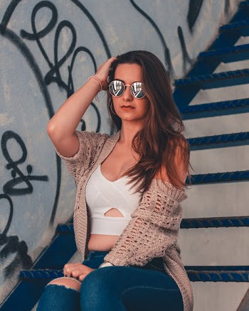 Woman Wearing Sunglasses Sitting on Stair