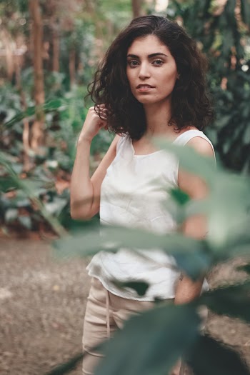 Woman Wearing Tank Top Standing Outdoors