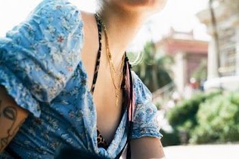 Woman Wearing Teal Floral Blouse