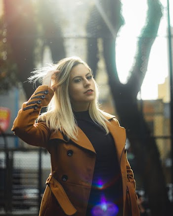 Woman Wearing Trench Coat Walking On Street