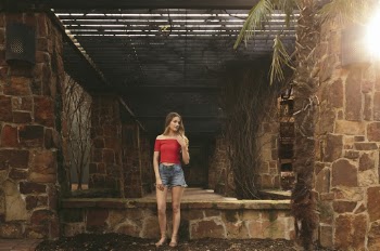 Woman Wearing Tube Top Standing Beside Wall