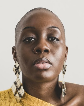 Woman Wearing Wearing Brown Earrings