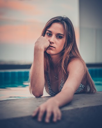 Woman Wearing White And Black Bikini Top In Pool