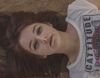 Woman Wearing White and Black Cattitude-printed Shirt