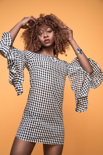 Woman Wearing White and Black Checkered 3/4 Sleeved Shirt