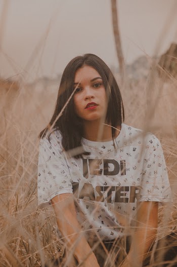 Woman Wearing White And Black Crew Neck T-shirt At Grass Field