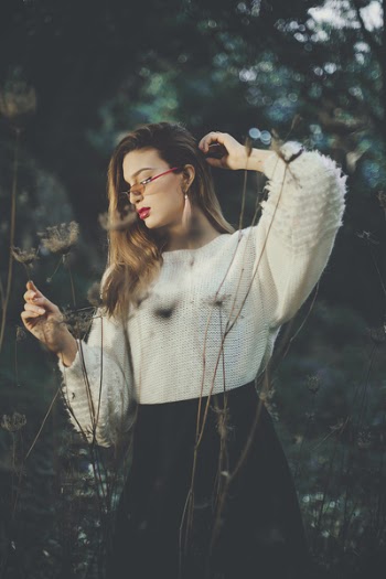 Woman Wearing White and Black Dress Standing in the Middle of Forest