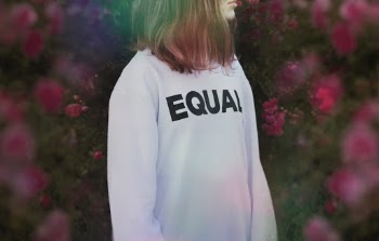 Woman Wearing White and Black Equal Printed Crew-neck Sweater